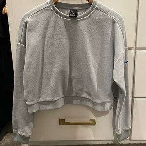 Nike medium light blue fleece crop sweatshirt side sip detail